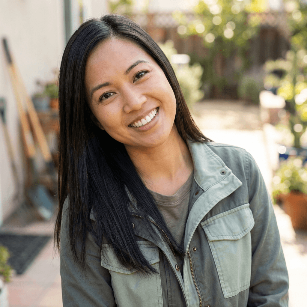 Female office manager in her late 20s, East Asian, professional and upbeat